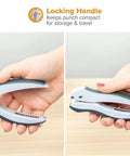 Hands holding EZ Squeeze One-Hole Paper Punch Pack of 3, 10 Sheet Capacity, with ergonomic grip and gray-blue finish, side view.