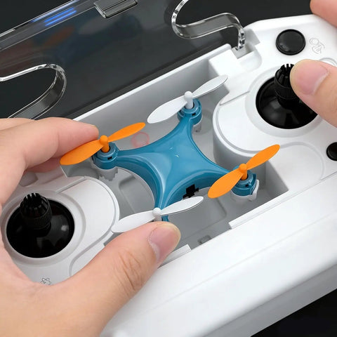 Hands holding a Beginner Friendly Mini Drone With One Button Takeoff And Altitude Hold, LED Lights For Night Fun, inside a controller case.