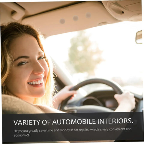 Smiling person driving a car with a focus on the vehicle's interior ceiling and steering wheel.