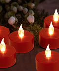 Red flameless LED tea lights glowing against a dark background, highlighting cozy ambiance with no open flame.