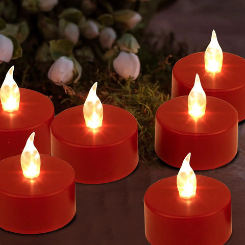 Red flameless LED tea lights glowing against a dark background, highlighting cozy ambiance with no open flame.