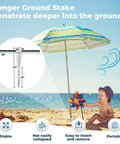 17 Inch Stainless Steel Screw In Ground Stakes With Deep Spiral Anchor securing umbrella on sandy beach next to child.
