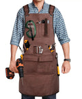 Mens Heavy Duty Canvas Shop Apron With Nine Deep Tool Pockets Water And Oil Resistant Pro Workhorse Gear Built Like A Tank For Woodworking And All Day Shop Tasks, worn with tools.