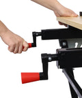 Person adjusting the vise on the Hella Tough Portable Workbench Featuring A Heavy Duty Vise Foldable Work Table Holding Up To 550 Pounds.