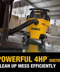 Yellow Stealthsonic 5 Gal Wet Dry Shop Vacuum 4 HP Ultra Quiet Cleaner in workshop on wet floor.