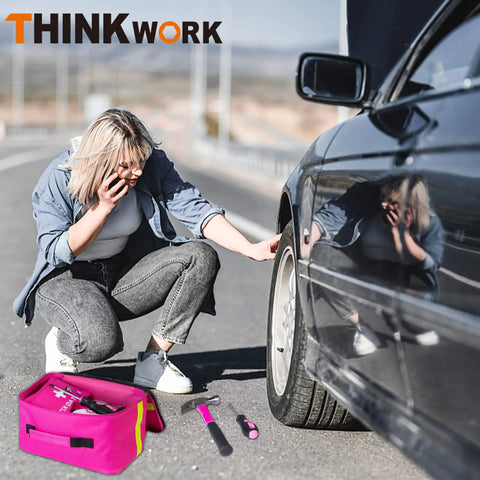 Woman using Pink Car Emergency Kit For Women And Teens, Roadside Help Essentials With Pink Tool Set, 10ft Jumper Cables, First Aid Kit, And More Cute Car Accessories Gift Idea For Her