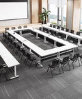 No Fuss Slick Heavy Duty Foldable Mobile Training Table With Secure Lock Swivel Rollers And Tall Privacy Screen in modern seminar setup.