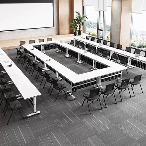 No Fuss Slick Heavy Duty Foldable Mobile Training Table With Secure Lock Swivel Rollers And Tall Privacy Screen in modern seminar setup.