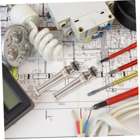 Brass Cable Glands Kit 4 Pack With 2 Way Glands And Metal Connectors on electrical plan background with tools