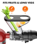 Front view of a KitchenAid stand mixer masticating juicer attachment with dual feed chutes; celery stalks and orange slices.