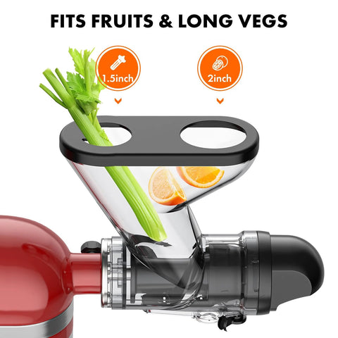Front view of a KitchenAid stand mixer masticating juicer attachment with dual feed chutes; celery stalks and orange slices.