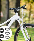 White bicycle with 9Pcs Bike Stem Spacers Set Aluminum Alloy Headset Spacers For 1 1/8 Inch Stems Includes 15mm 10mm heights overlay