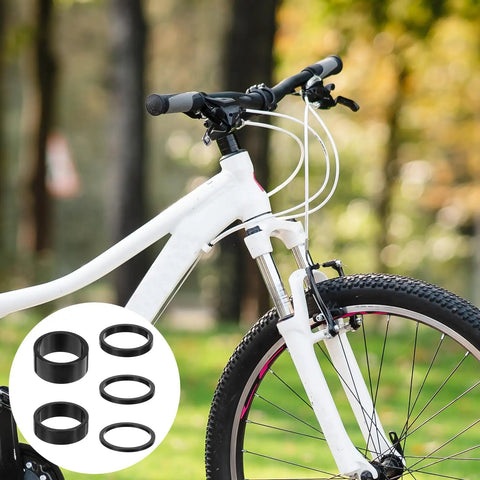 White bicycle with 9Pcs Bike Stem Spacers Set Aluminum Alloy Headset Spacers For 1 1/8 Inch Stems Includes 15mm 10mm heights overlay