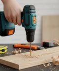 A hand using a power drill with a screw on wood, showcasing the 1300 Piece Wood Screw Kit Featuring M2 M2.5 M3 Flat Head Self Tapping Design Crafted From Heavy Duty Carbon Steel With Knockout Rust Resistance And No Fuss Installation For Weekend Warrior Projects.