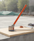 Manual Rail Cutter Tool Hand Operated Bench Rail Cutter Heavy Duty with orange handle on concrete surface