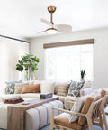 Compact Ceiling Fan With Remote And LED Light For Bedroom And Covered Patio 28 Inch Three Blade Brass Body in living room