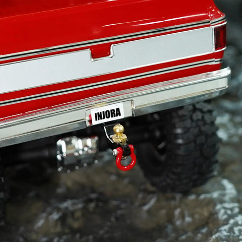 Drop Hitch Receiver For 1/18 RC Crawler TRX4M Upgrade, CNC Aluminum Build with Red Tow Hook installed on RC bumper.
