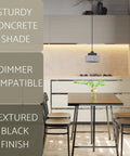 Xander 11 Inch Modern Pendant Light With Concrete Drum Shade And Textured Black Finish in a kitchen setting