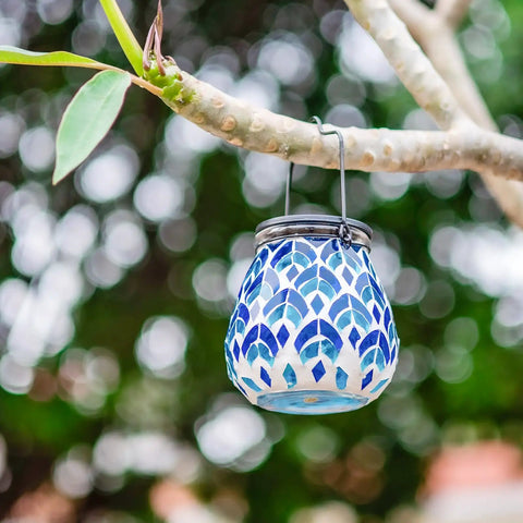 Solar Mosaic Lanterns For Outdoor Lighting hanging on a tree branch, blue and white glass, ideal for garden decor