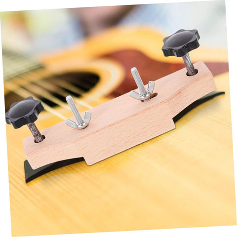 Guitar Bridge Clamp Repair Tool Set on acoustic guitar for precise bridge alignment, wood and metal construct