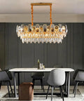 Premium Smoke Gray Crystal Chandelier Ceiling Fan 42 Or 48 Inch Dimmable LED Lights Smart Three Color Remote Control Gold Tone Blades in modern dining space.