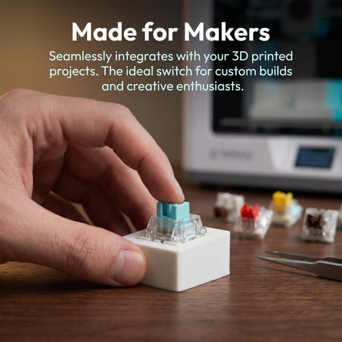 50 Pcs Mechanical Keyboard Switches Tester Pack With 10 Keychains Including 10 Of Each Style Blue Clicky And Quiet Linear Variants For Custom Builds Tactile Feedback And A Handy DIY 3D Print Companion, hand testing switch on 3D printed base