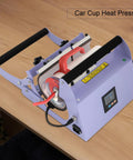 Heavy Duty 40 Oz Tumbler Heat Press Machine With Sturdy Iron Body, adjustable temp settings, freestanding design on wooden table.