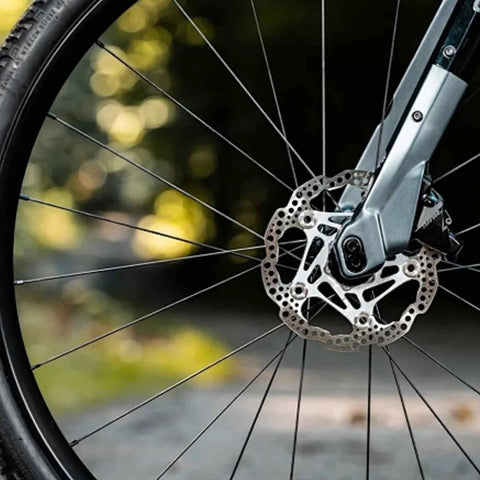Close-up of bicycle wheel with J Bend Bicycle Spokes 282mm 14G With Nipples Black Steel Replacement Spokes for MTB and road bike.