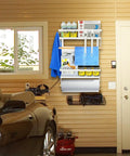 Magnetic Foldable Paper Towel Holder With Shelf And 5 Removable Hooks 2-In-1 Garage Storage Organizer installed on garage wall.