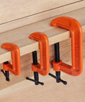 Heavy Duty Malleable Iron C Clamp Set Three Piece With 1 Inch 2 Inch And 3 Inch Jaw Openings Built For Woodworking Metalworking And Quick Home Repairs That Just Works securing a wooden plank