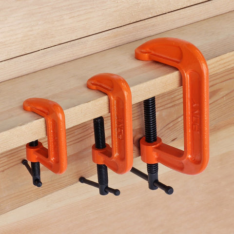 Heavy Duty Malleable Iron C Clamp Set Three Piece With 1 Inch 2 Inch And 3 Inch Jaw Openings Built For Woodworking Metalworking And Quick Home Repairs That Just Works securing a wooden plank