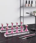 Pink Nail Art Display Stands Set With 54 Adhesive Putty Pieces, Acrylic Nail Stands With Magnetic Tips And Chess Shaped Tips on table