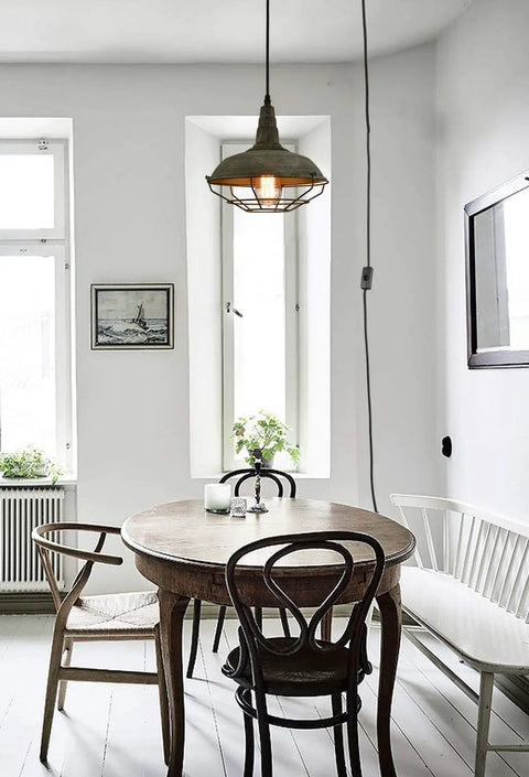 Farmhouse Plug In Pendant Light With 16 Feet Hanging Cord And Wire Cage Shade In Dark Charcoal Gray Finish over dining table
