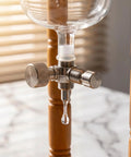 720 Milliliter Cold Brew Coffee Tower With Adjustable Valve drip control close-up, showcasing stainless steel valve for brewing.