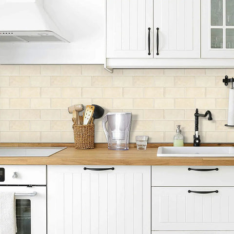Thick Peel And Stick Backsplash Tiles In Beige Marble Look for Kitchen, shown installed in a bright kitchen setting.
