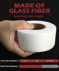 Hand holding Fiberglass Mesh Drywall Tape Self Adhesive Patch Roll 1.97 Inch By 150 Feet For Wall Ceiling Crack Repair