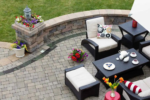 Water Based Stone Enhancer And Sealant For Marble Granite Limestone Straight Up One Step All In One Formula That Deepens Color Without Adding Gloss Gallon Size Patio setting with seating, flowers, and table.