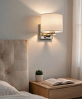 Edwarmlux Indoor Wall Sconces, Brushed Nickel, 1 Pack, E26 Bulbs Excluded, stylish fabric lampshade by bedside with warm light.