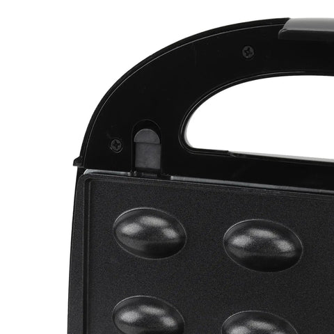 Close-up of the black cooking plate on the Get That Crispy Crunch Every Time With This Badass 10 Plate Electric Panini Press.