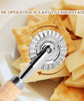 Pastry wheel cutter with fluted stainless-steel wheel and wooden handle, angled front view.