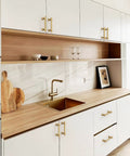 Modern kitchen with Champagne Bronze Cabinet Pulls 3 Inch Center To Center 76mm Pack Of 10 Honey Bronze Kitchen Handles on white cabinets