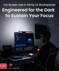 ScreenBar Halo 2 LED Monitor Light Bar With Wireless Controller illuminating a dimly lit workspace, enhancing focus.