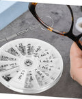 Eyeglass Repair Kit With Screws And Precision Screwdriver For Glasses Sunglasses And Watches The All In One Tool For Easy Quick Fixes At Home Or On The Go, round container with screws and screwdriver shown next to eyeglasses being repaired.