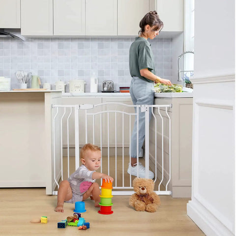 Adjustable 29.5 To 53 Inch Wide Baby Gate For Doors And Stairs, 30 Inch Tall, pressure-mounted white gate in kitchen doorway