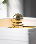 Close-up of Polished Brass Wall Swing Arm Lamp with Off White Fabric Shade Delivers Classic Vibe And Traditional Style