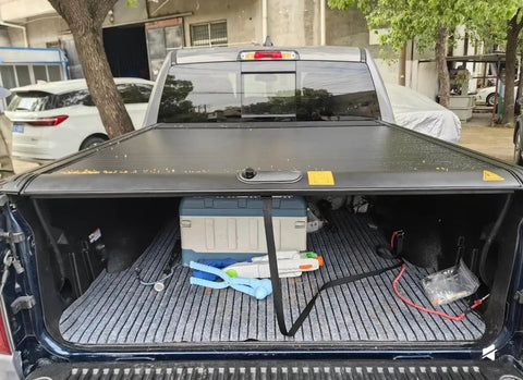 Rear view of a truck with Retractable Truck Bed Tonneau Cover For L200 Triton 2024 2025 2026, Aluminum Slats With Weatherproof Seal open.
