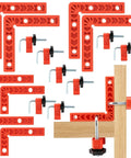 Sixteen Piece Right Angle Clamp Set For Woodworking With 90 Degree Positioning Squares, shown clamping wooden boards, red color
