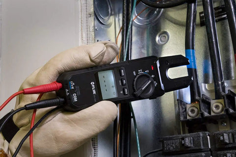 Voltage, Continuity And Current Tester With Open Jaw, 1000V 200A, CAT IV Safety in use by a technician in protective gloves