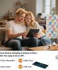 Couple using tablet by Watercolor Monstera Leaf Palm Decor Bedside Lamp with Three Way Dimmable Touch Control and Charging Station