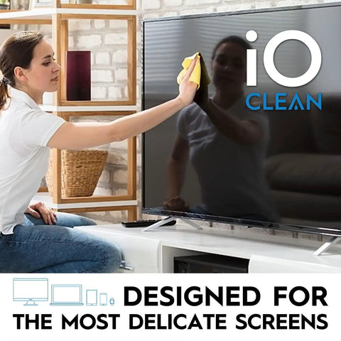 Person using Screen Cleaner Spray 16 Oz All In One Cleaning Kit For LCD LED OLED TVs Smartphones Tablets Laptops Monitors And Other Devices Includes Microfiber Cloth Wipes And Dual Nozzle Bottles For Fast Smudge Free Shine on a TV screen.